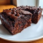 Close-up of a moist Cottage Cheese Microwave Brownie topped with chocolate chips.