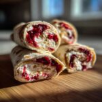 Close-up of delicious cranberry tortilla roll ups filled with cream cheese and cranberry filling.