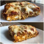 A delicious slice of Pizza-style Cottage Cheese Bake with melted cheese and marinara sauce.